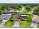 Aerial view of a home with a fenced backyard, mature trees, and a paved driveway at 5433 81St Avenue E Cir, Palmetto, FL 34221