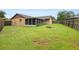 Spacious backyard shows the enclosed patio and fire pit for outdoor enjoyment at 5433 81St Avenue E Cir, Palmetto, FL 34221