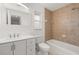 Bathroom featuring a vanity, toilet, tiled shower, and window with natural light at 5433 81St Avenue E Cir, Palmetto, FL 34221