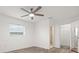 Bedroom with wood-look floors, ceiling fan, neutral walls, and an ensuite bathroom at 5433 81St Avenue E Cir, Palmetto, FL 34221
