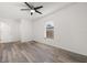 Bedroom featuring sleek floors, a ceiling fan, and a window with natural light at 5433 81St Avenue E Cir, Palmetto, FL 34221