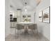 Cozy dining area with stylish furnishings, tile floors, and modern lighting fixtures at 5433 81St Avenue E Cir, Palmetto, FL 34221