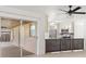 Bright kitchen view with stainless steel appliances, wood cabinets, and a sliding glass door to the outdoor patio at 5433 81St Avenue E Cir, Palmetto, FL 34221