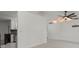 Minimalist living room featuring tile flooring and a view of the kitchen area at 5433 81St Avenue E Cir, Palmetto, FL 34221