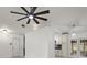 Open living space featuring tile flooring, a ceiling fan, and access to the kitchen and dining areas at 5433 81St Avenue E Cir, Palmetto, FL 34221