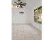 Bright living area with tile flooring, ceiling fan, and a large window offering natural light at 5433 81St Avenue E Cir, Palmetto, FL 34221