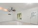 Bright and airy living room with tiled floors and a window showcasing the outdoor greenery at 5433 81St Avenue E Cir, Palmetto, FL 34221