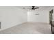 Bright living room with tile flooring, ceiling fan, and sliding glass doors to the outside at 5433 81St Avenue E Cir, Palmetto, FL 34221