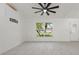 Minimalist living room with bright tile floors, large windows, and abundant natural light at 5433 81St Avenue E Cir, Palmetto, FL 34221