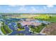 Stunning aerial view showcasing the community clubhouse, pool, tennis courts, and lush landscaping in a vibrant setting at 5695 Palmer Cir # 203, Bradenton, FL 34211