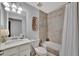 Charming bathroom with tiled shower-tub combo, vanity, and great lighting at 5695 Palmer Cir # 203, Bradenton, FL 34211