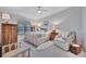 Cozy bedroom featuring neutral decor, soft lighting, and a comfortable armchair at 5695 Palmer Cir # 203, Bradenton, FL 34211