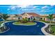 Aerial view of the clubhouse with a circular driveway, colorful landscaping, and a well-manicured lawn at 5695 Palmer Cir # 203, Bradenton, FL 34211