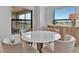 Cozy dining area with a round table and seating for four, near a window at 5695 Palmer Cir # 203, Bradenton, FL 34211