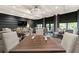 Elegant dining area with large tables, stylish chairs, and ample natural light at 5695 Palmer Cir # 203, Bradenton, FL 34211