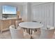 Cozy dining area with seating for four, a side board, and a view out the window at 5695 Palmer Cir # 203, Bradenton, FL 34211