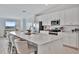 Bright kitchen with a large island, stainless appliances, and white cabinets at 5695 Palmer Cir # 203, Bradenton, FL 34211