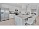 Modern kitchen with white cabinetry, stainless steel appliances, and quartz countertops at 5695 Palmer Cir # 203, Bradenton, FL 34211