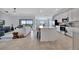 Spacious open-concept living area showcasing a modern kitchen and comfortable seating at 5695 Palmer Cir # 203, Bradenton, FL 34211