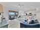 Open concept living area with outdoor views from a patio, adjacent to the kitchen at 5695 Palmer Cir # 203, Bradenton, FL 34211