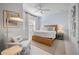 Relaxing bedroom with wood-frame bed and bright white walls at 5866 Cavano Dr, Sarasota, FL 34231