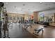 Bright gym features treadmills, weight machines, and mirrors for a complete workout experience at 5866 Cavano Dr, Sarasota, FL 34231
