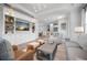 Spacious living room with a built-in entertainment center, stylish furniture, and hardwood floors at 5866 Cavano Dr, Sarasota, FL 34231