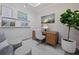 Elegant office space featuring a wooden desk and a modern decor at 5866 Cavano Dr, Sarasota, FL 34231