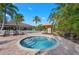 Community spa surrounded by palm trees, lounge chairs and patio in the background at 5866 Cavano Dr, Sarasota, FL 34231