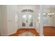Bright foyer with tile flooring, decorative rug, and an elegant front door at 5897 Carriage Dr, Sarasota, FL 34243