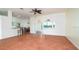Living room showcasing tile floors, and large windows looking out to a beautiful pool at 5897 Carriage Dr, Sarasota, FL 34243
