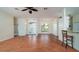 Bright living room showcasing tile floors, and large windows looking out to a beautiful front yard at 5897 Carriage Dr, Sarasota, FL 34243