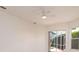 Bright living room with sliding glass doors leading to a screened patio and pool area at 5897 Carriage Dr, Sarasota, FL 34243