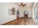 Open-concept living area with hardwood floors and easy access to the kitchen and outdoor patio at 5897 Carriage Dr, Sarasota, FL 34243