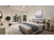 Serene main bedroom with soft tones, a comfortable bed, and access to the lanai at 5897 Carriage Dr, Sarasota, FL 34243