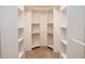 Well-organized walk-in closet with ample shelving and storage space at 5897 Carriage Dr, Sarasota, FL 34243
