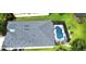 Aerial view of home with pool and screen, surrounded by lush green lawn at 6107 French Creek Ct, Ellenton, FL 34222