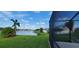 Expansive backyard with lawn and view of the lake at 6107 French Creek Ct, Ellenton, FL 34222