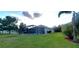 Large backyard with covered pool and lawn at 6107 French Creek Ct, Ellenton, FL 34222