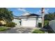 Charming home with a well-manicured lawn, complemented by a lush garden and a spacious two-car garage at 6107 French Creek Ct, Ellenton, FL 34222