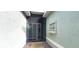Covered front entryway with decorative window and screen doors at 6107 French Creek Ct, Ellenton, FL 34222
