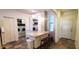 Well-designed kitchen area featuring a center island, modern appliances, and convenient access to laundry at 6107 French Creek Ct, Ellenton, FL 34222