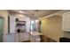 Bright kitchen with ample counter space, stylish accents, and a cozy eat-in area with modern lighting at 6107 French Creek Ct, Ellenton, FL 34222