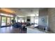 Lounge with modern decor, comfortable seating, and bar top area near the entrance at 6107 French Creek Ct, Ellenton, FL 34222