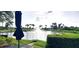 Beautiful pond view showcasing a fountain, lush landscaping, and tranquil water at 6107 French Creek Ct, Ellenton, FL 34222