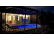Outdoor pool area with chairs, decorative lighting, and manicured landscaping at 6107 French Creek Ct, Ellenton, FL 34222