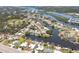 Aerial view of homes and properties along winding neighborhood canals at 619 Albee Farm N Rd, Nokomis, FL 34275