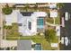 Stunning aerial view of home featuring a solar panel system, screened-in pool, and boat dock on a canal at 619 Albee Farm N Rd, Nokomis, FL 34275