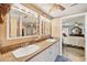 Bathroom features double sinks, countertop, and vanity with the bedroom just through the doorway at 619 Albee Farm N Rd, Nokomis, FL 34275