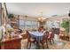 Traditional dining room boasts beautiful built-ins, a bay window, and seating for six around the formal dining table at 619 Albee Farm N Rd, Nokomis, FL 34275